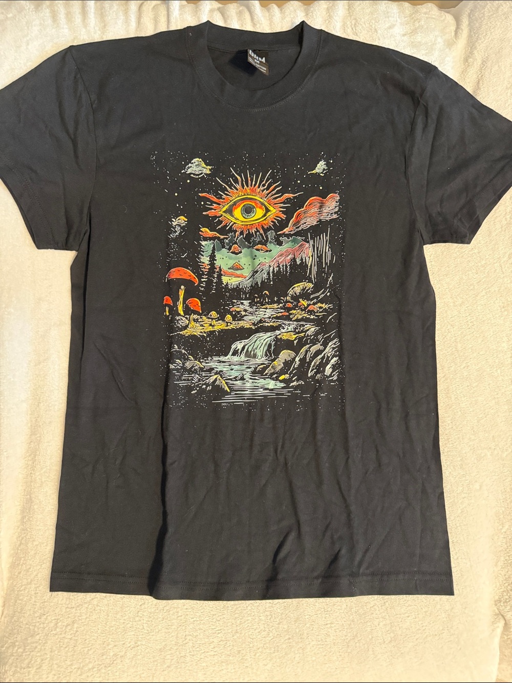 Black Graphic Tee with Psychedelic Sunrise Eye Design